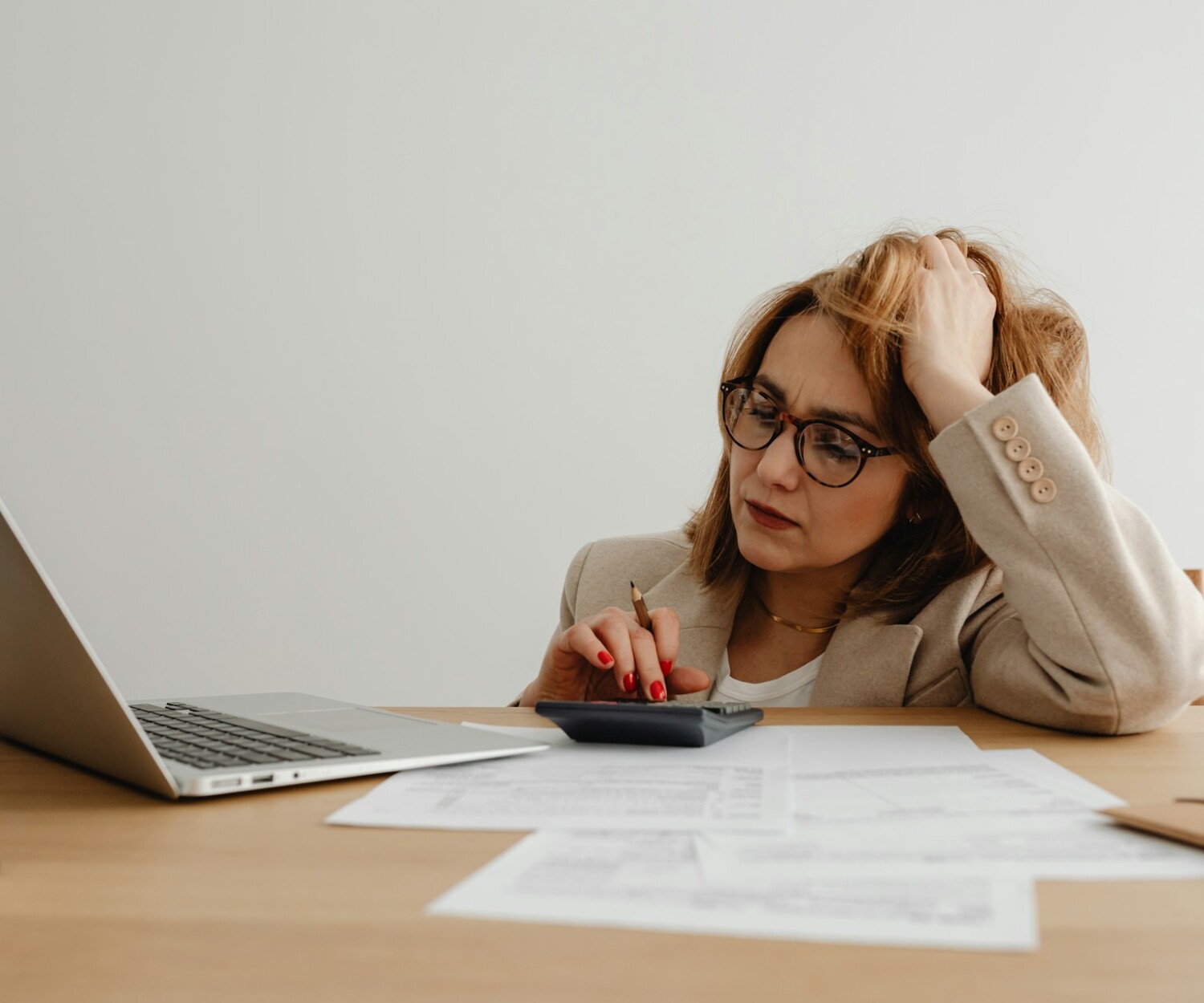 Frustrated woman sitting in front of laptop